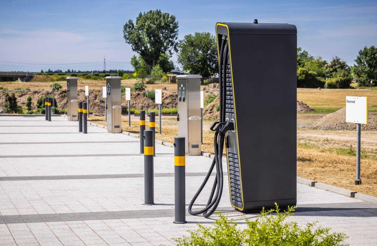 Power supply for electric car charging, charger at parking lot.