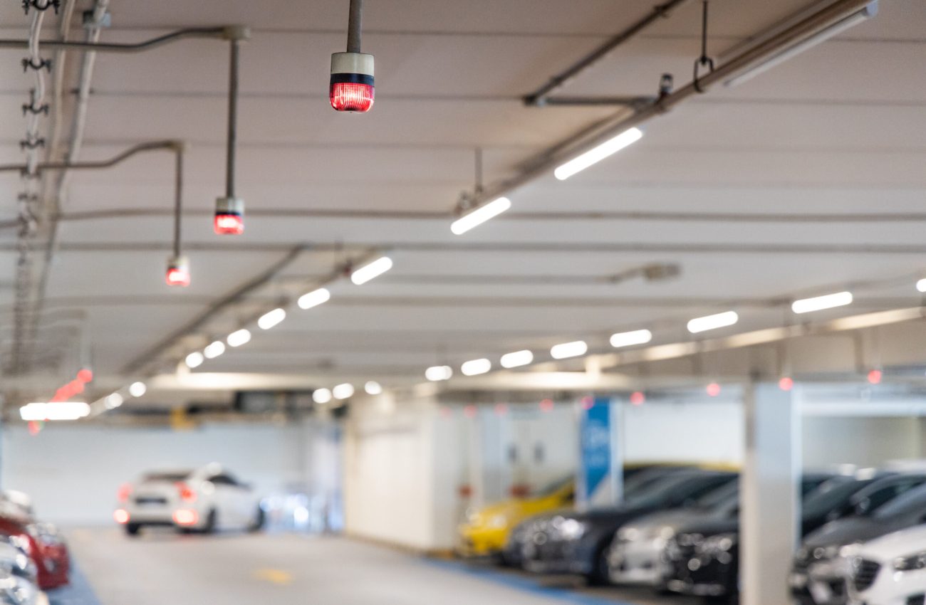 Smart car parking tracking system in mall with lights signals to track, indicated and navigate car to available vacancy